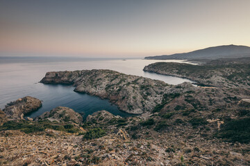 A rocky beach next to a body of water