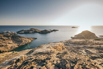 A rocky beach next to a body of water