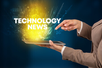 Fototapeta na wymiar Close-up of a touchscreen with TECHNOLOGY NEWS inscription, innovative technology concept