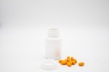 Medication in the form of capsules/pills/tablets against a white background
