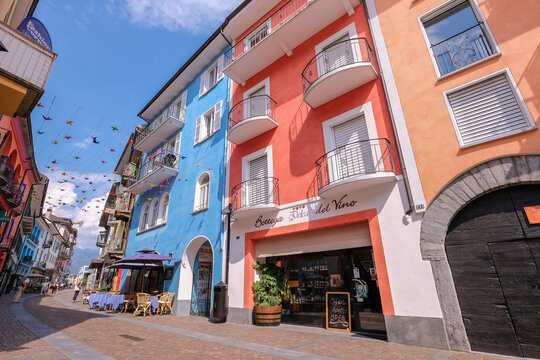 Ascona, Ticino, Switzerland, June 04, 2019: Beautiful Colorful Houses And Wine Bodega Store In The Streets Of Ascona