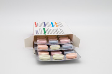Medication in the form of capsules/pills/tablets against a white background