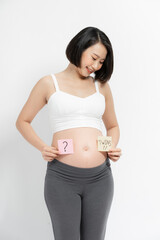 Pregnant woman with stick notes on her belly