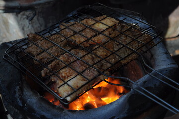 Roasted beef on charcoal grilled Isan Thai food that is bold and delicious.