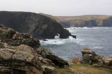 Fototapeta na wymiar The rocky cliffs at Strathy Point on the Sutherland coast of northern Scotland, UK.