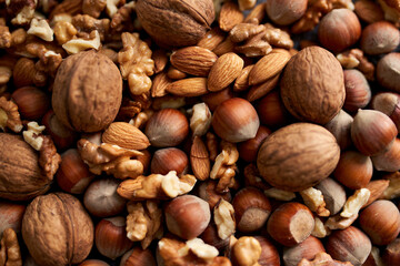 Mix of different nuts, background with walnuts, almonds and hazenuts