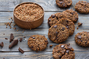 Healthy gluten-free buckwheat cookies with chocolate on a wooden table