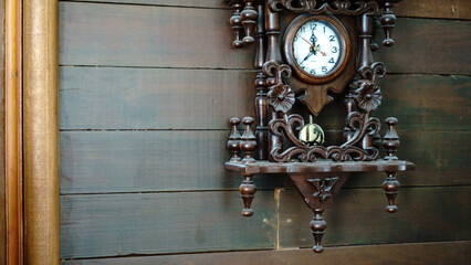 Brown old wooden wall With clocks