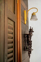 Brown old wooden wall With clocks and lantern