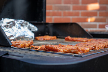 Barbeque BBQ food being cooked and prepared outdoors in the summer