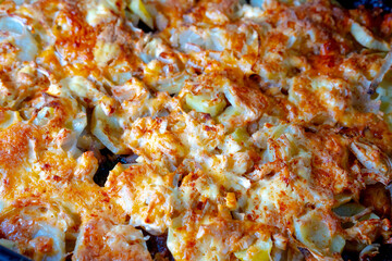 Potato with melted cheese and meat