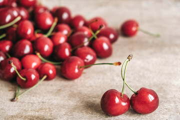 Fresh ripe cherries on wooden background. Copy, empty space for text