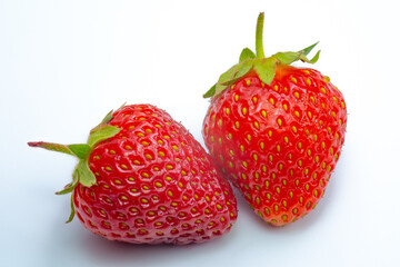 Ripe strawberries on a white background