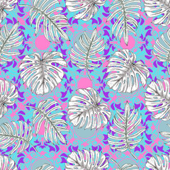 White tropical leaves on a colored background