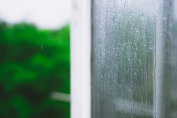 Raindrops on a wet foggy window