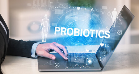 Doctor working a health check with PROBIOTICS inscription, recording medical test results