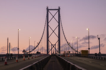 Forth Road Bridge closed for repairs in the evening against the sunset sky. United Kingdom