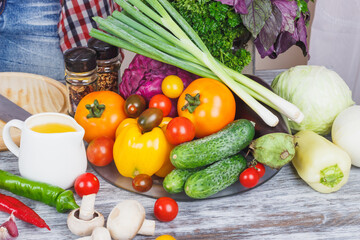 Woman cooks at the kitchen, soft focus background
