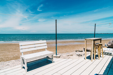 outdoor table and chair with sea beach background