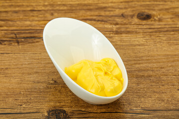 Natural cheese sauce in the bowl