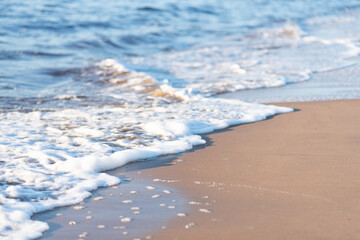 on a sandy beach beautiful gentle turquoise tide of waves