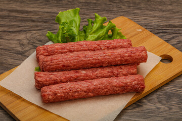 Raw beef sausages with spices