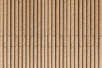 Modern brown stone wall with stripes texture and seamless background