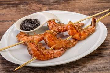 Grilled prawn skewer with pepper sauce