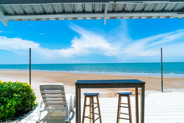 wood bar and chair with sea beach background