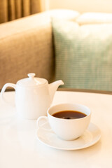 Obraz na płótnie Canvas tea cup with teapot on table