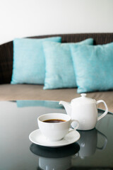 Fototapeta na wymiar tea cup with teapot on table