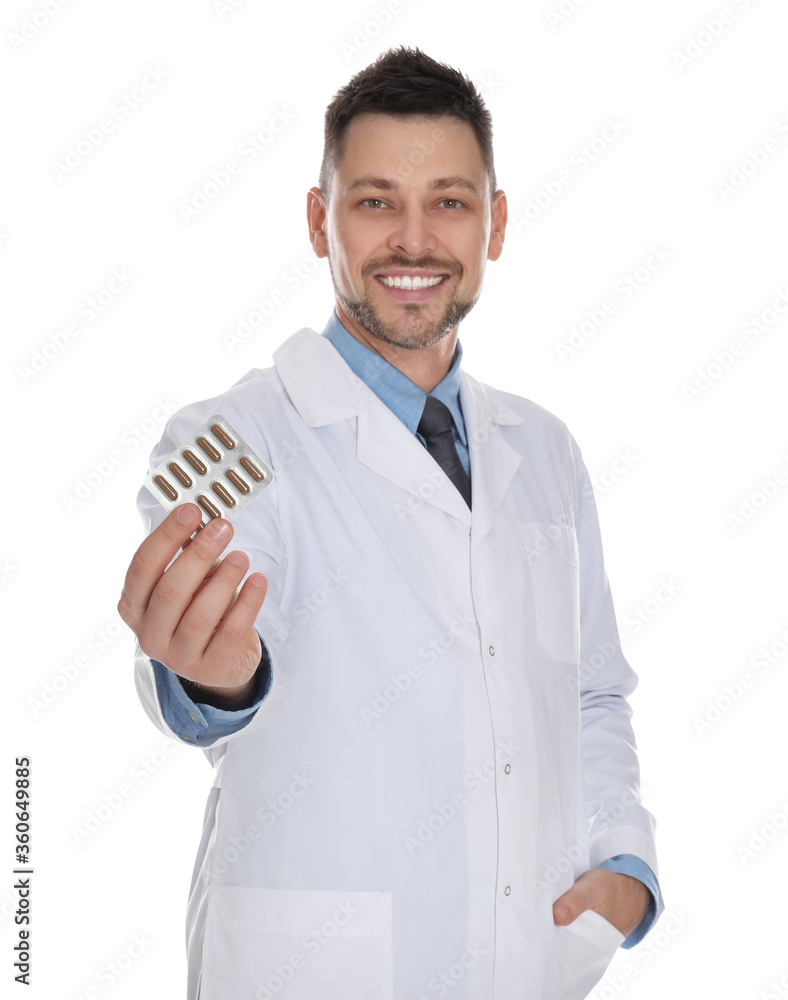 Wall mural professional pharmacist with pills on white background