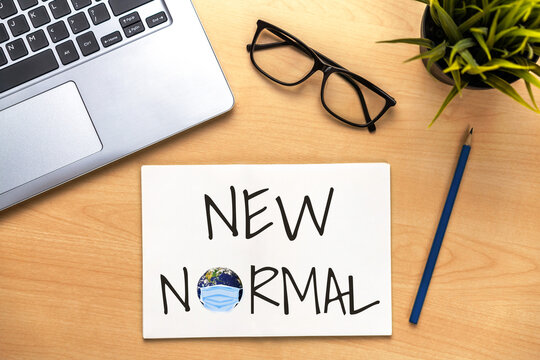 New Normal Concept Effected By COVID 19 Coronavirus That Changes Our Lifestyle To New Normal Presented In Word Written In Notebook On Office Desk When Abnormal Becomes New Normal .