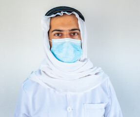 Arabic muslim doctor wearing mask with hygiene products