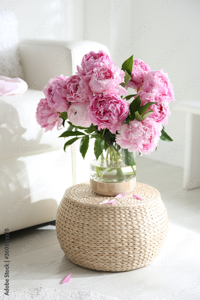 Canvas Prints Bouquet of beautiful peonies on pouf indoors