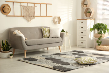 Stylish living room interior with comfortable sofa - obrazy, fototapety, plakaty