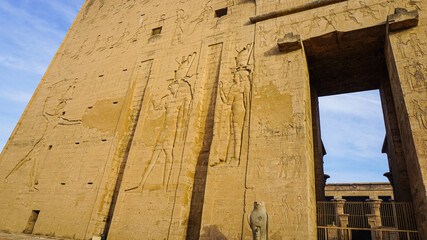 Entrance of Edfu temple of Horus majestic beautiful landmark with ancient blue paint on wall