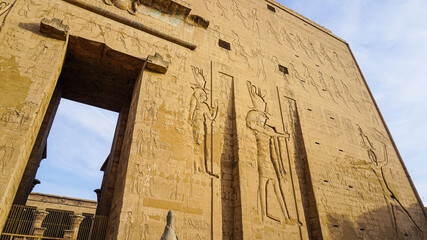 Entrance of Edfu temple of Horus majestic beautiful landmark with ancient blue paint on wall