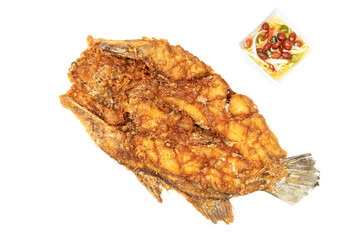Deep fried sea bass with fish sauce and green mango chili fish sauce, based on chili fish sauce, addition of shredded green mango and lime juice isolated on white background.