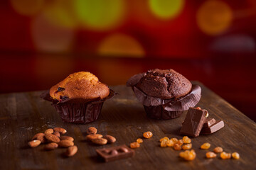 Chocolate maffin on a wooden table with chocolate and tartallini