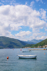 Beautiful summer Mediterranean landscape - blue sky and blue bay. Montenegro, Adriatic Sea, view of the Bay of Kotor near the city of Tivat