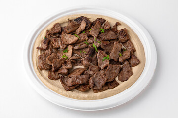 Hummus with beef . A dish of crushed chickpeas for delivery, or  online store. Isolated on a white background.