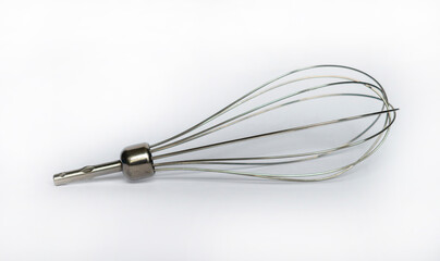 Stainless steel whisk isolated on white studio background