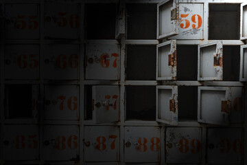 horror scene of rusty locker with red number and keys in the dark