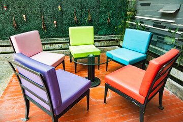 A Set of colorful chairs in living room