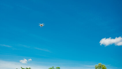 Fototapeta na wymiar The drone flying in the sky