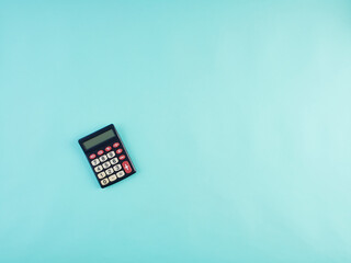Calculator on light blue background