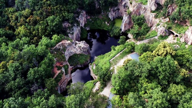 Flooded ancient stone quarry in Hungary near Sarospatak: Megyer-hegyi tengerszem. Small lake at the top of a hill. View from the top. Fantastic nature attraction in Tokaj area. 