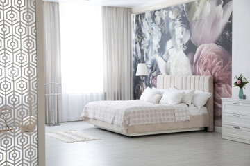 Big comfortable bed in modern room. Interior design