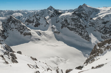Winter scenery with Fleckistock and and Sustenhorn from the top of Mount Titlis. 